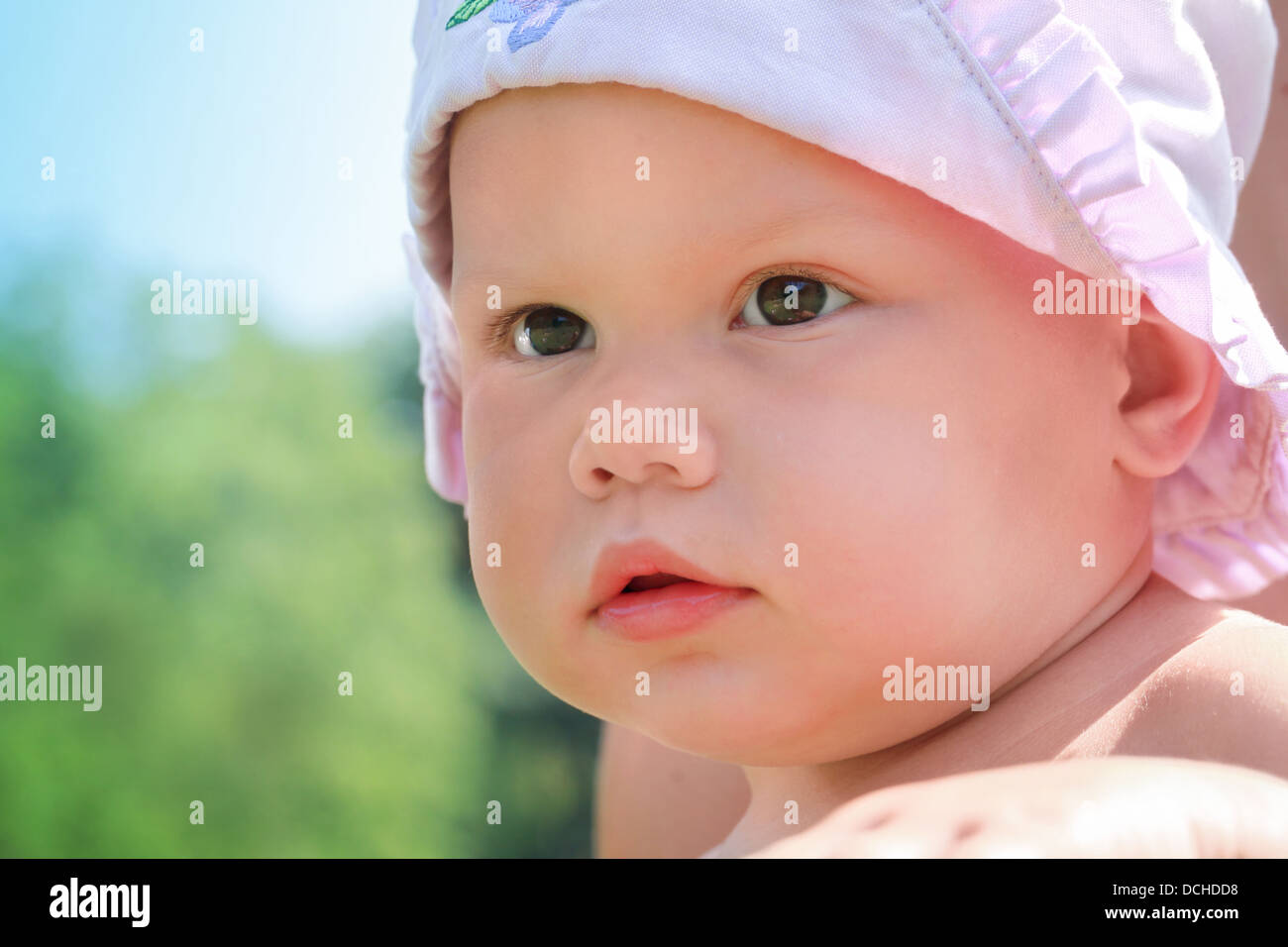 Little baby girl closeup outdoor portrait Stock Photo