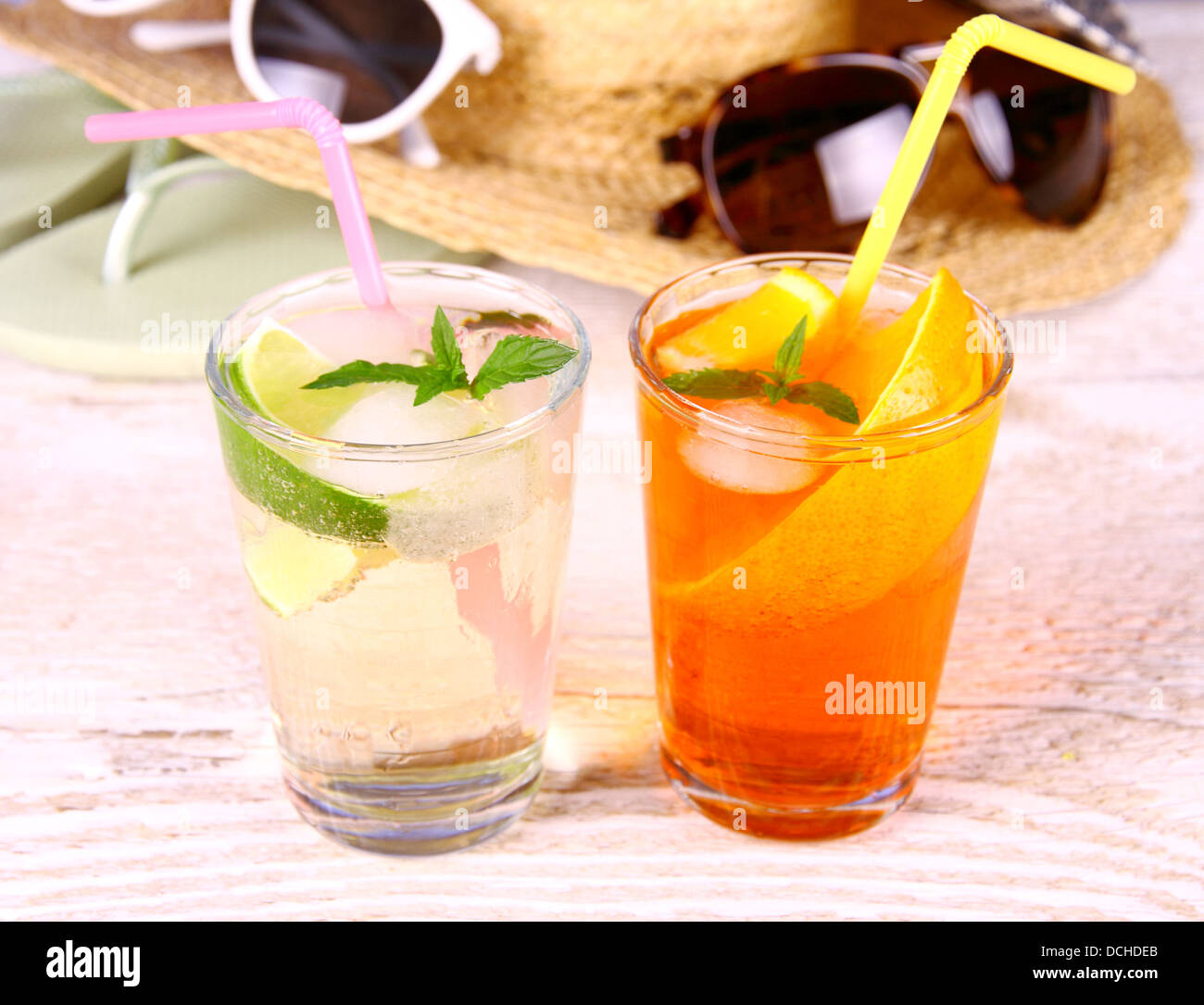 Mojito, orange cocktails with straw and holiday background, close up Stock Photo