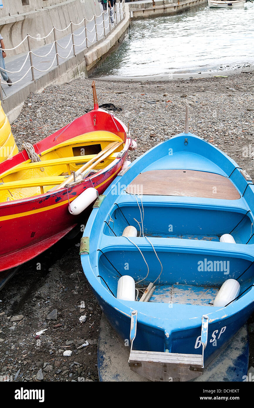 small colorful boats in dry dock in cinque terre italy, in the village of vernazza Stock Photo