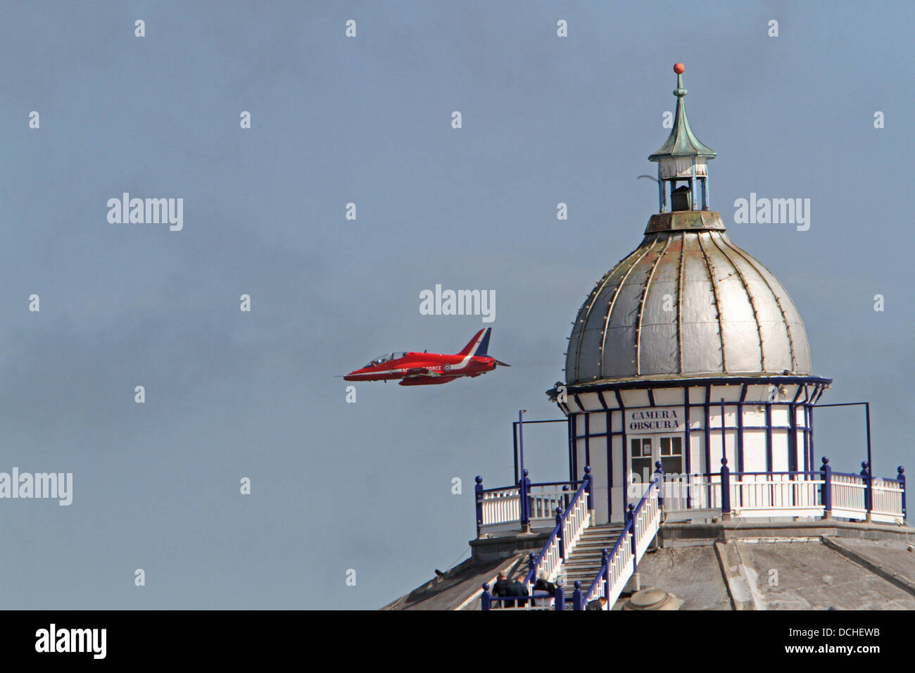 Eastbourne,UK,18th August 2013,A Red Arrow flies over the camera obscura on the pier during the Airbourne air display in Eastbourn Credit: Keith Larby/Alamy live News Stock Photo