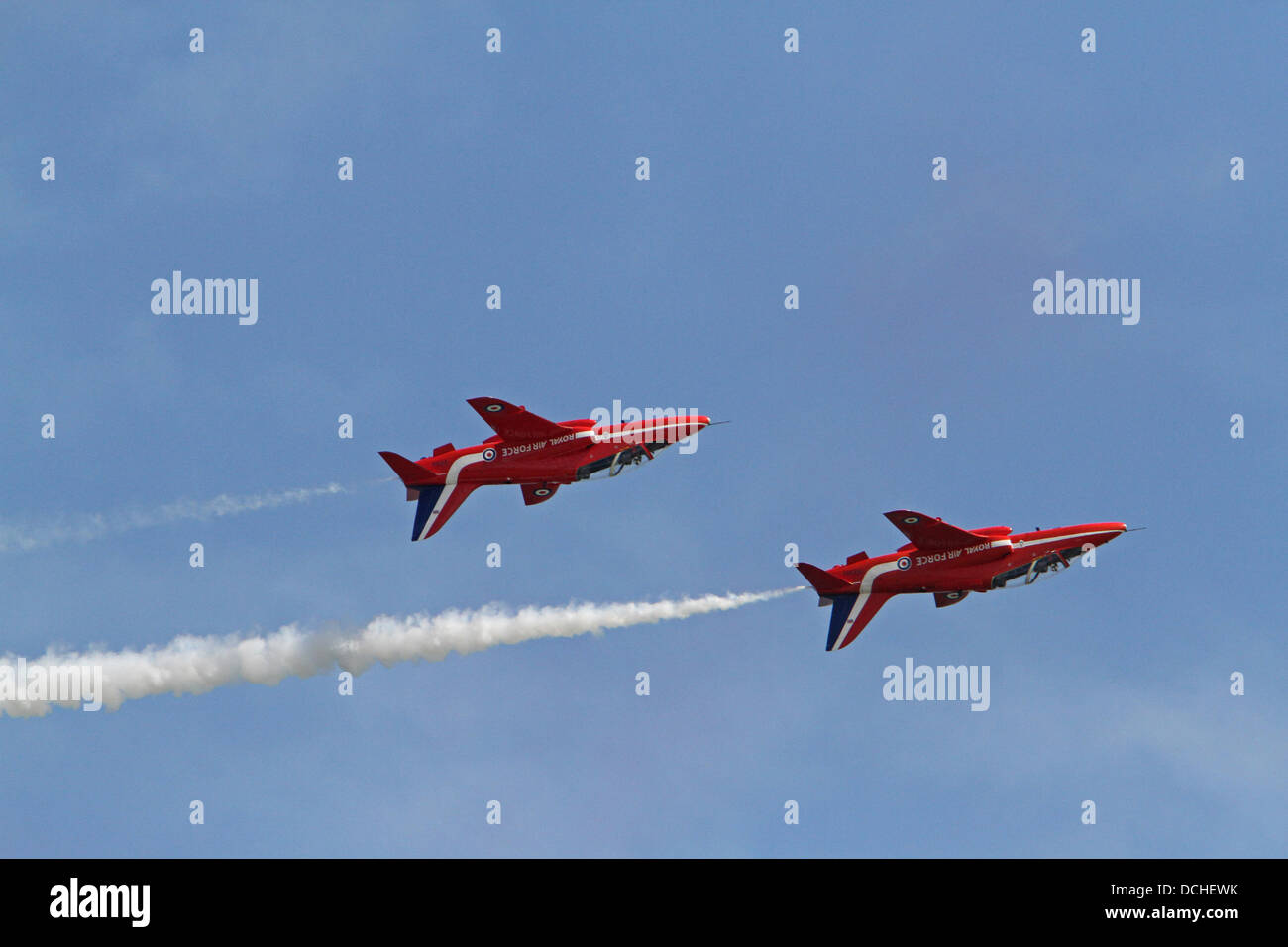 Eastbourne,UK,18th August 2013,The Red Arrows fly upside down over the pier in the sunshine during the Airbourne air display in Eastbourn Credit: Keith Larby/Alamy live News Stock Photo
