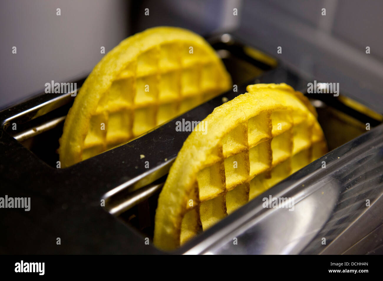 Two Kellog's Eggo breakfast waffles in a toaster Stock Photo