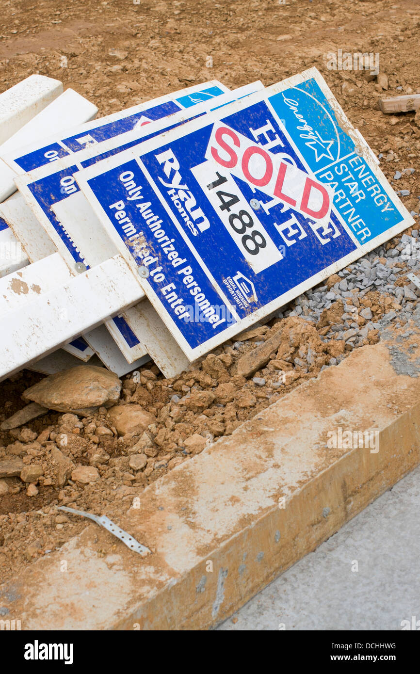 Ryan Homes 'Sold' signs in a new housing development.  Stock Photo