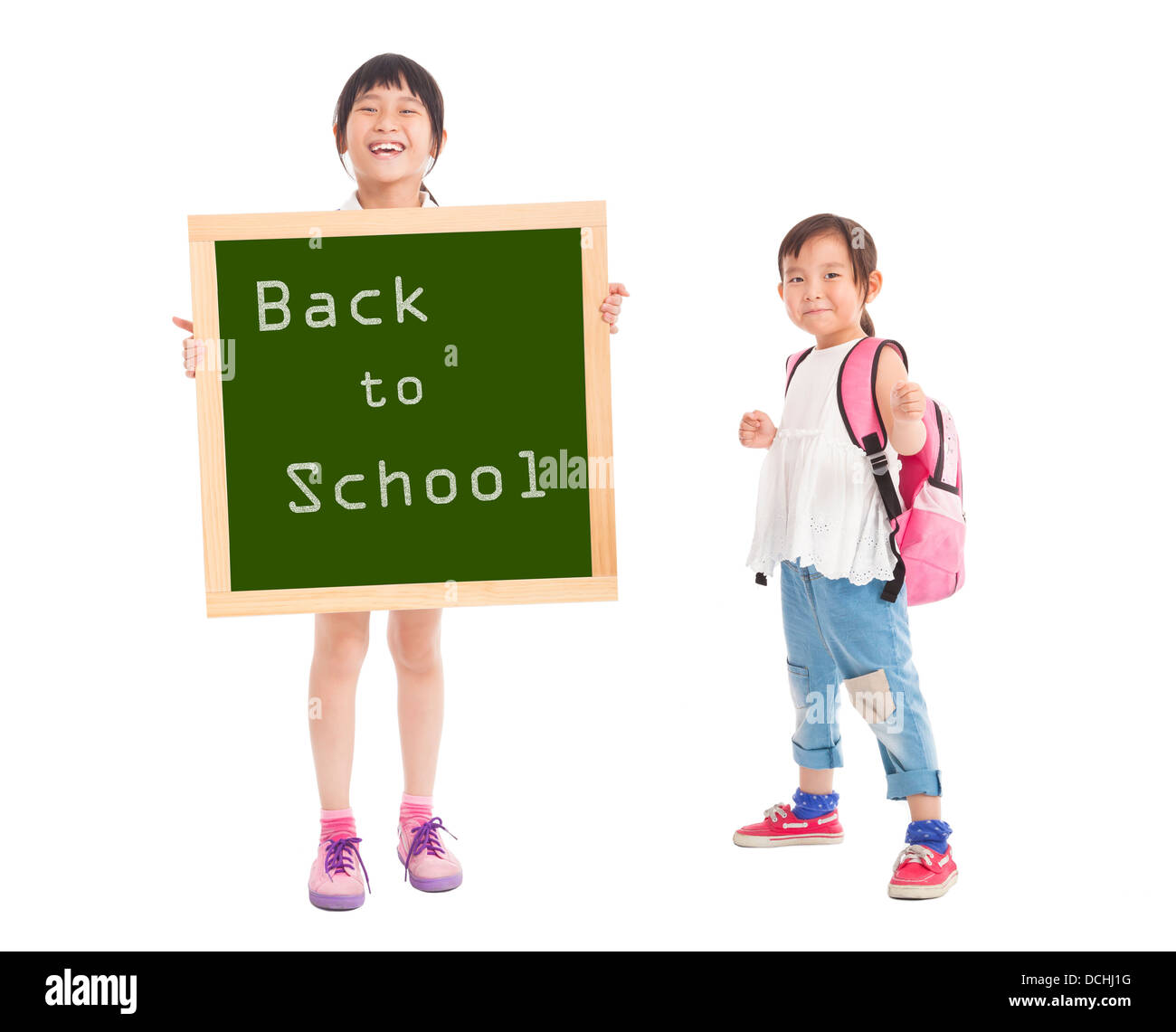 happy little girls showing back to school with chalkboard Stock Photo