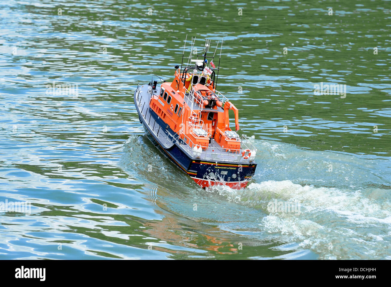 A radio controlled lifelike model of the newhaven lifeboat being put