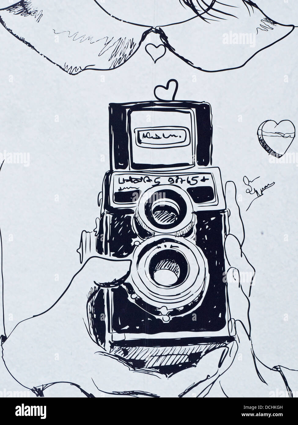 Drawing of a girl holding a twin reflex camera Stock Photo