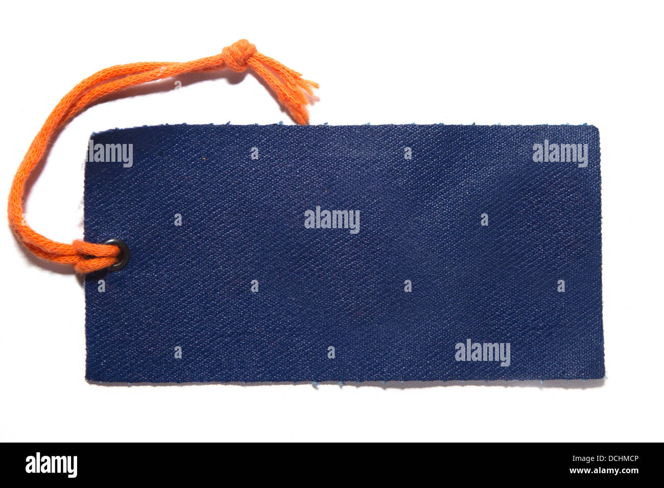 Denim cloth label with orange thread on white with visible shadow Stock Photo
