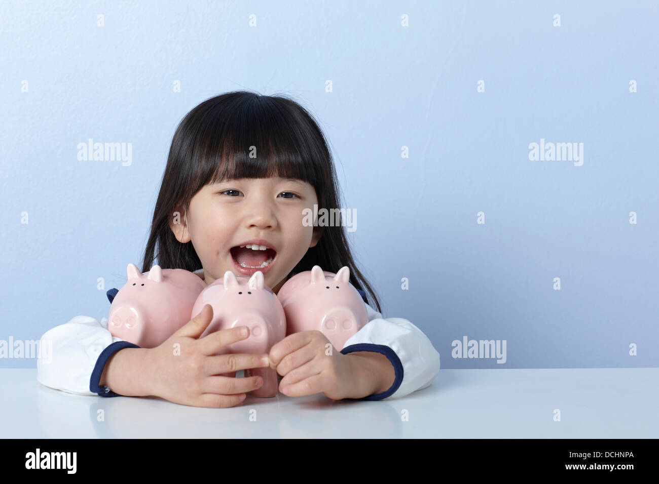 a girl with piggy banks Stock Photo - Alamy