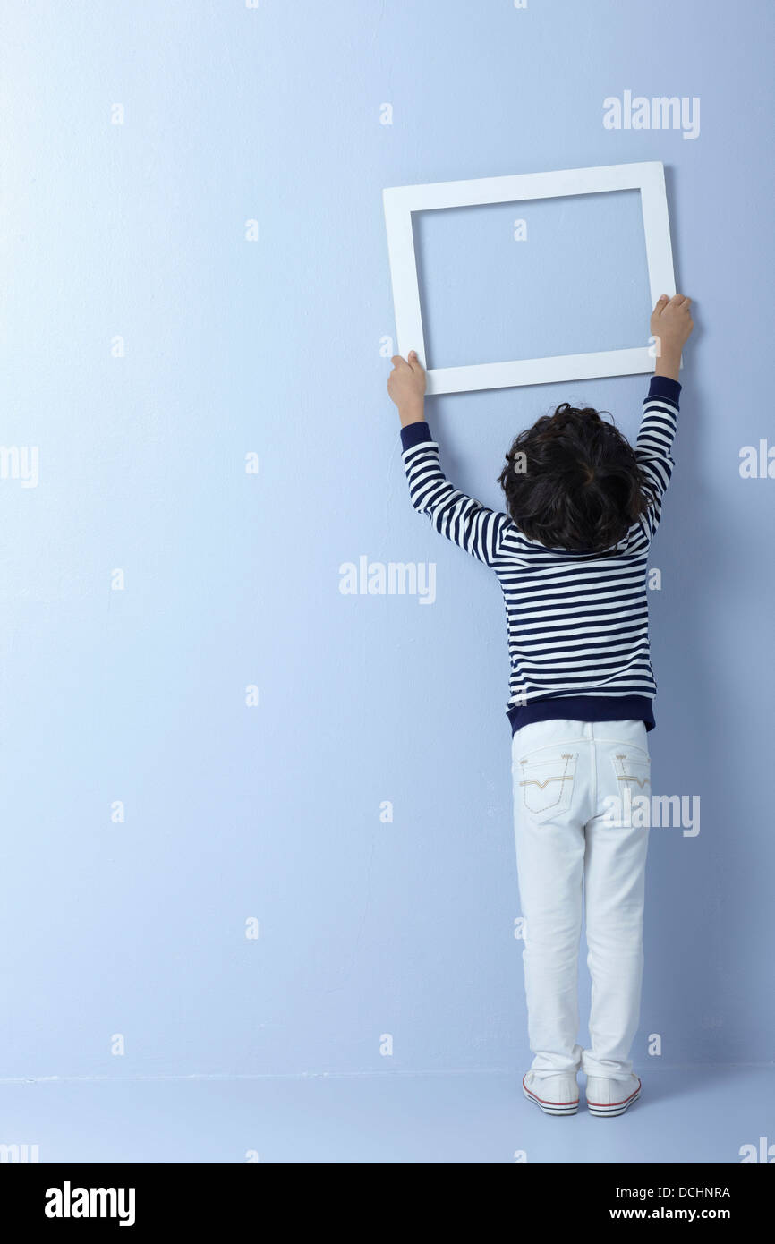 a boy with an empty frame Stock Photo - Alamy
