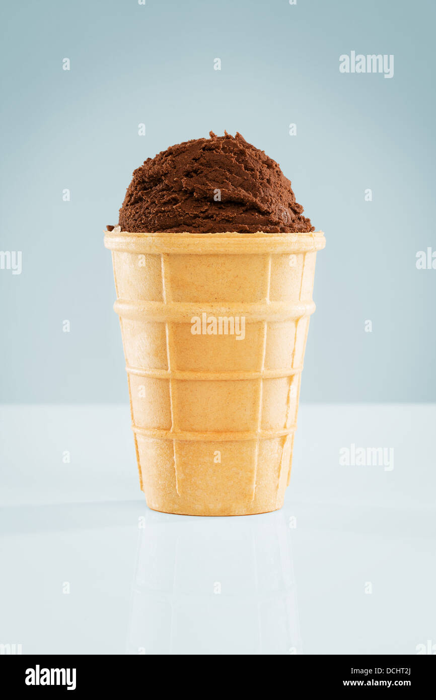 one scoop of chocolate ice cream in a standing waffle Stock Photo Alamy