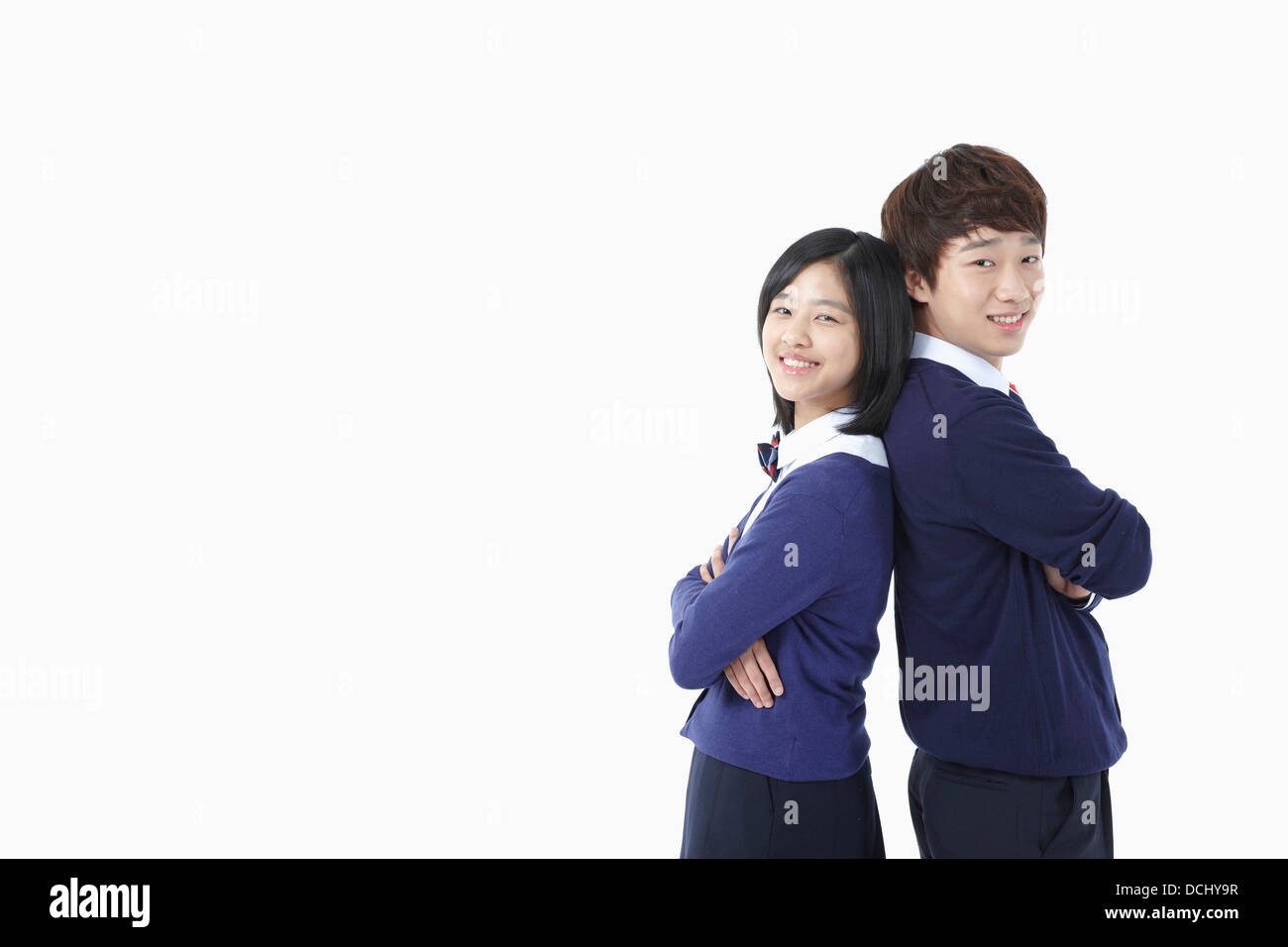 a boy and a girl in school uniforms Stock Photo Alamy