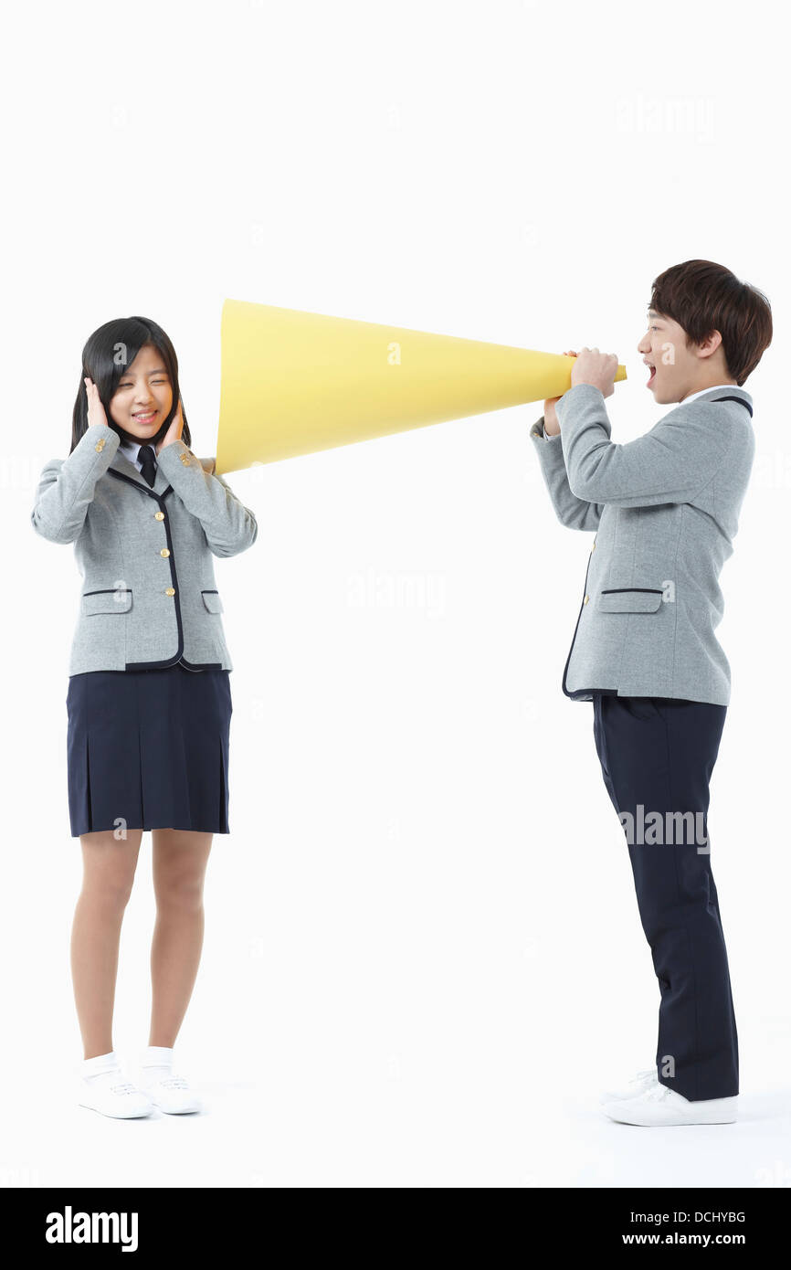 a boy and a girl in school uniforms Stock Photo Alamy