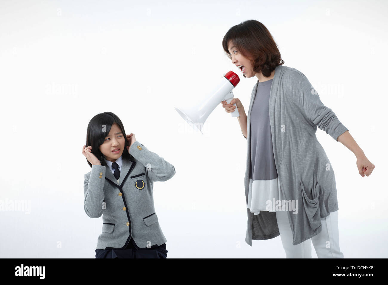 a mother yelling at daughter with a school uniform Stock Photo - Alamy