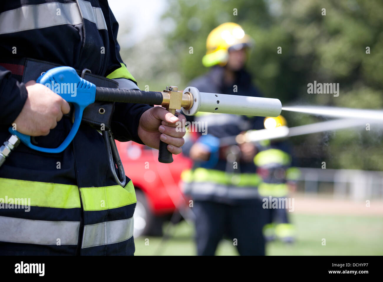 firefighters fighting fire during training Stock Photo Alamy