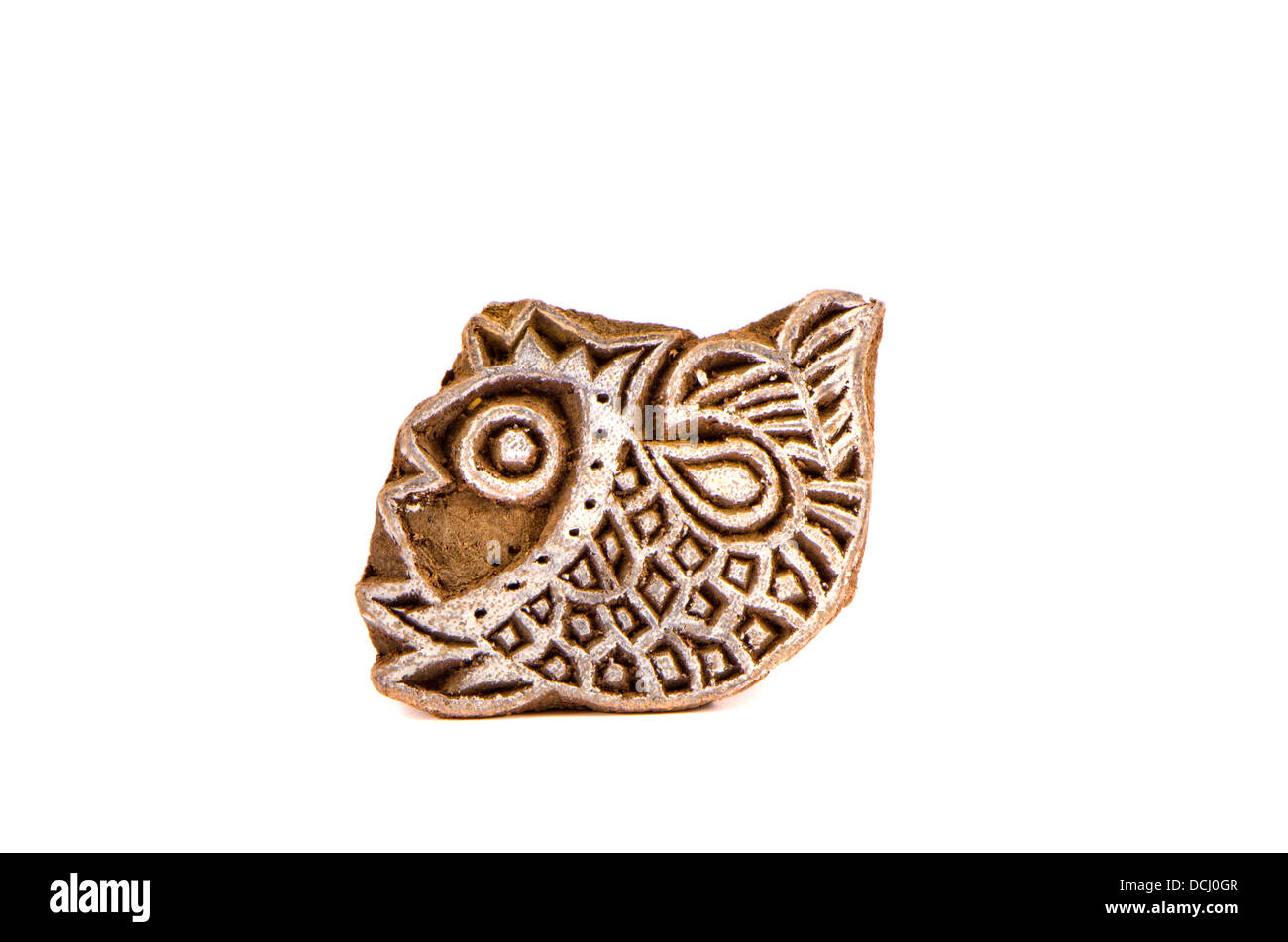 Indian wood carving printing block stamp for textile design. Fish picture Stock Photo