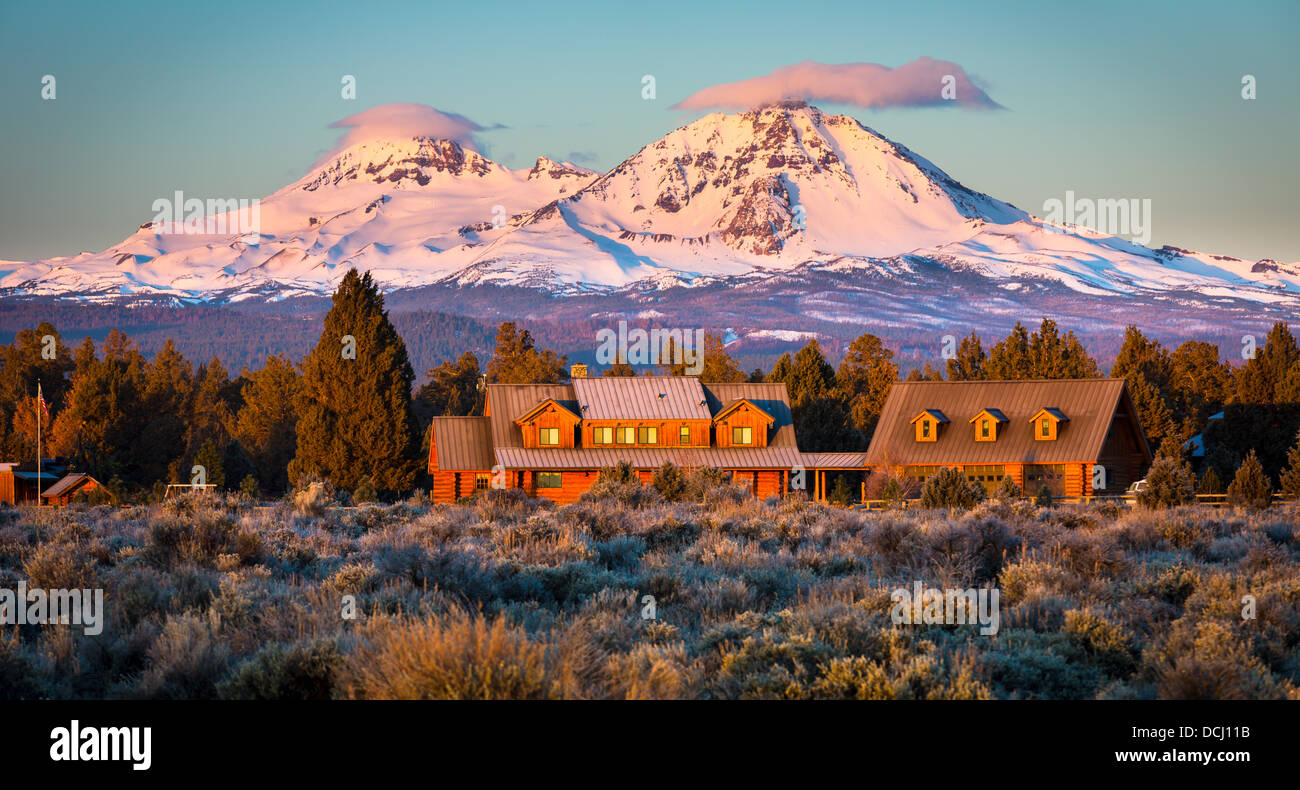 Ranch and the South and North Sister peaks in Oregon behind it Stock Photo