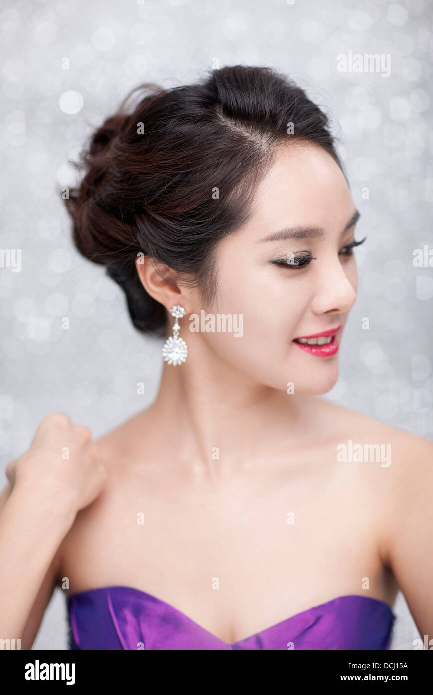 close up of a woman in purple dress posing gracefully Stock Photo - Alamy