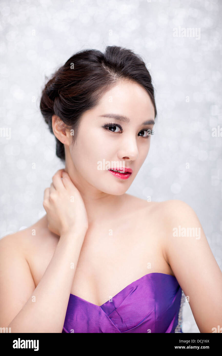close up of a woman in purple dress posing gracefully Stock Photo - Alamy