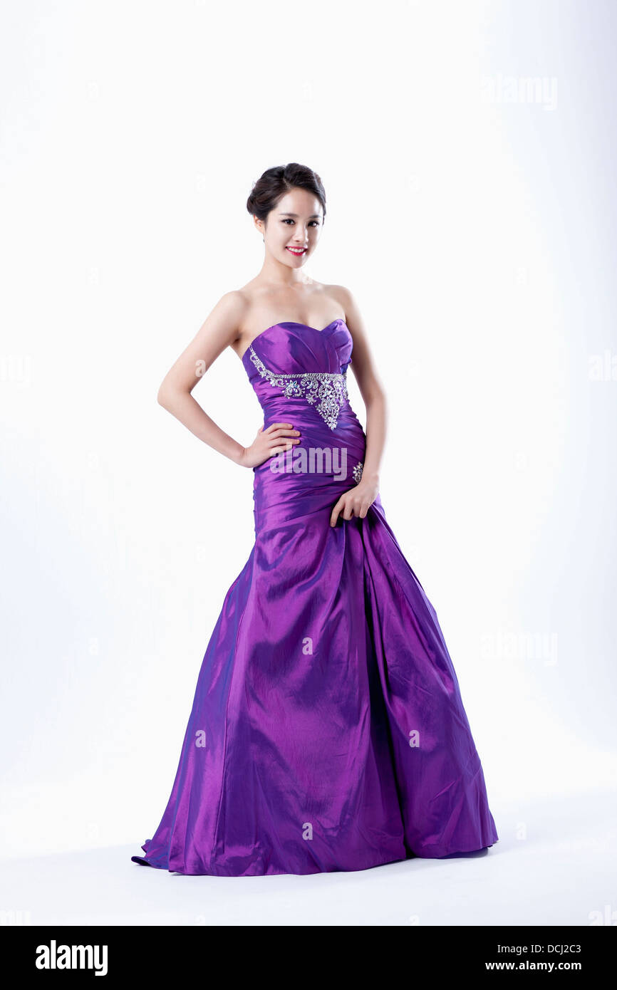 a lady in fancy purple dress posing gracefully Stock Photo - Alamy