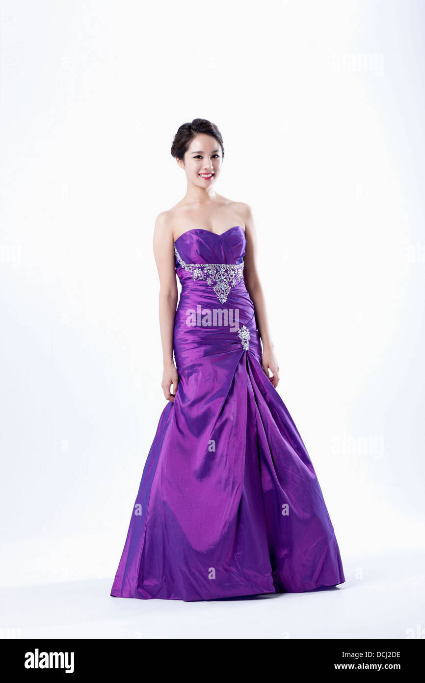 a lady in fancy purple dress posing gracefully Stock Photo - Alamy