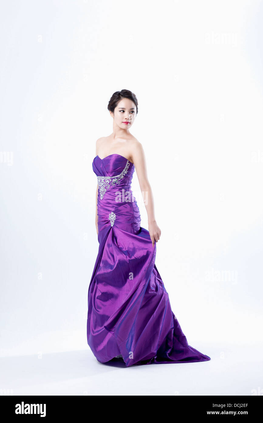 a lady in fancy purple dress posing gracefully Stock Photo - Alamy