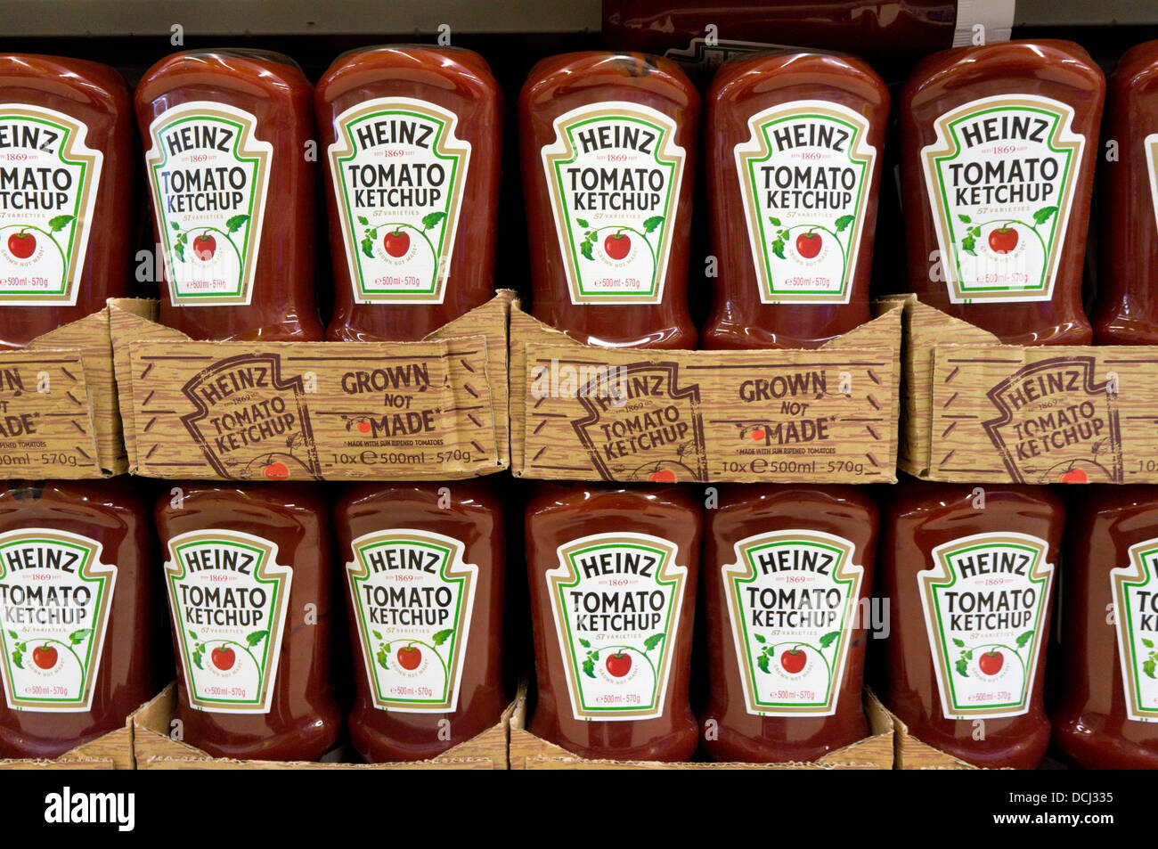 Bottles of Heinz Tomato Ketchup on a supermarket shelf. Stock Photo