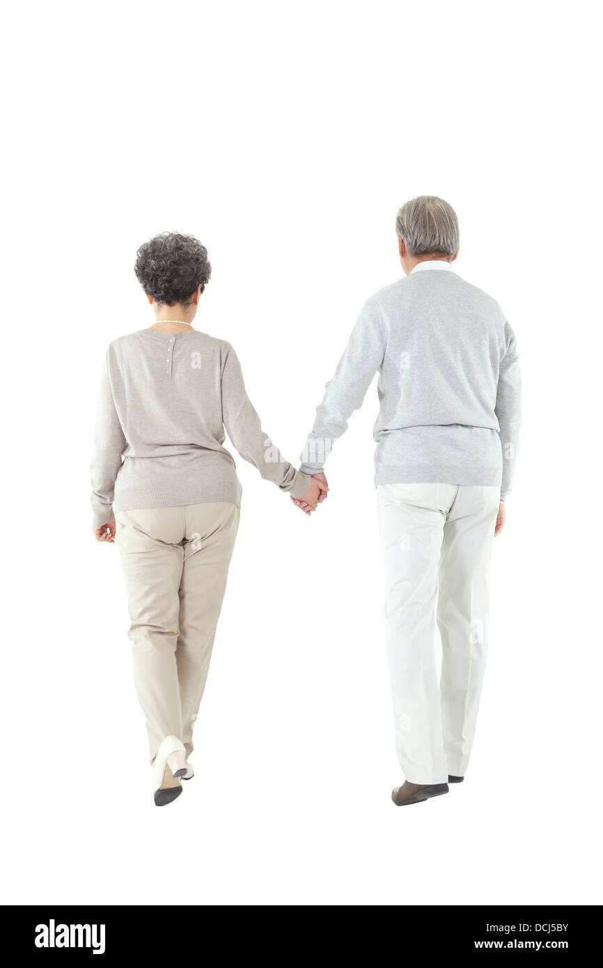 Oriental old couple walking hand in hand Stock Photo