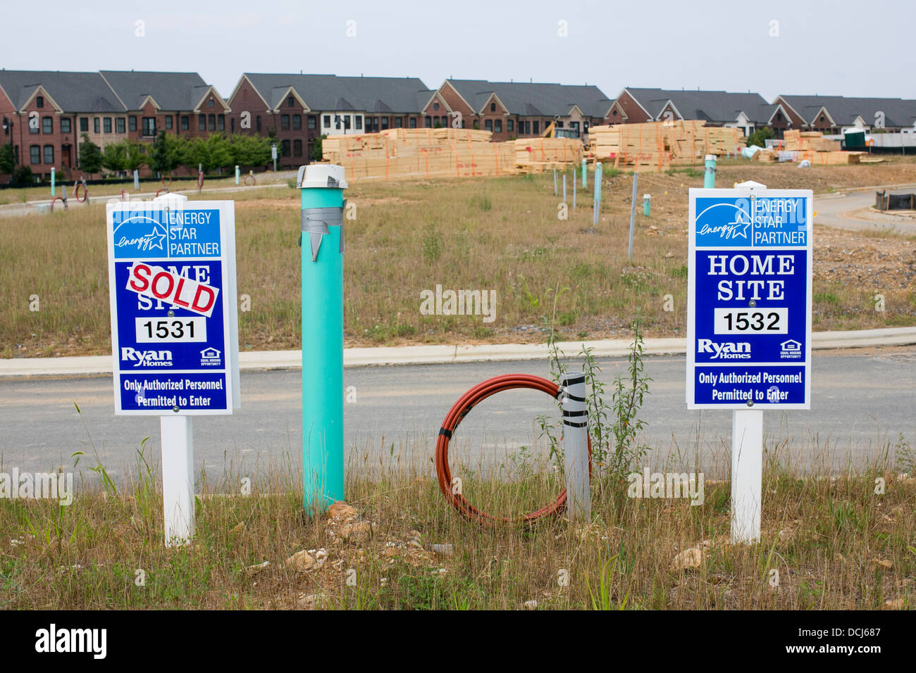 Ryan Homes 'Sold' signs in a new housing development.  Stock Photo