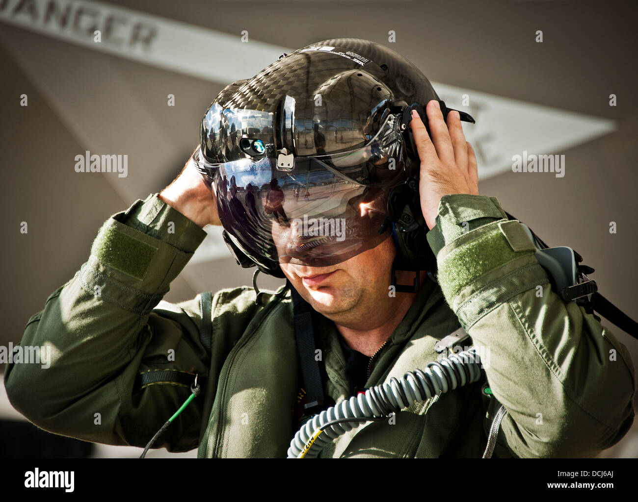 Lt. Cdr. Chris Tabert puts on the specialized helmet before piloting the first F-35C Lightning II flight at Eglin Air Force Base Aug. 14. Before arriving to U.S. Navy F-35 Strike Fighter Squadron VFA 101 in February, he served as a test pilot for the join Stock Photo