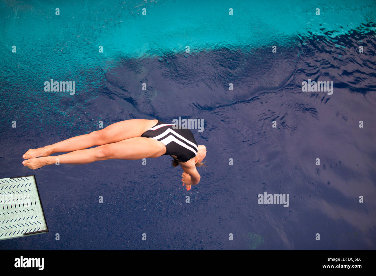 high diver jumping into the water Stock Photo Alamy