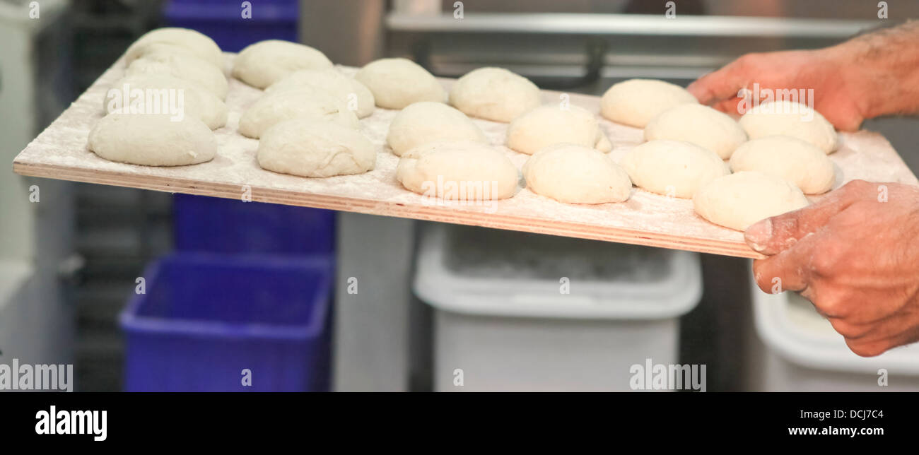 Yeast bread dough rises in a bakery Stock Photo