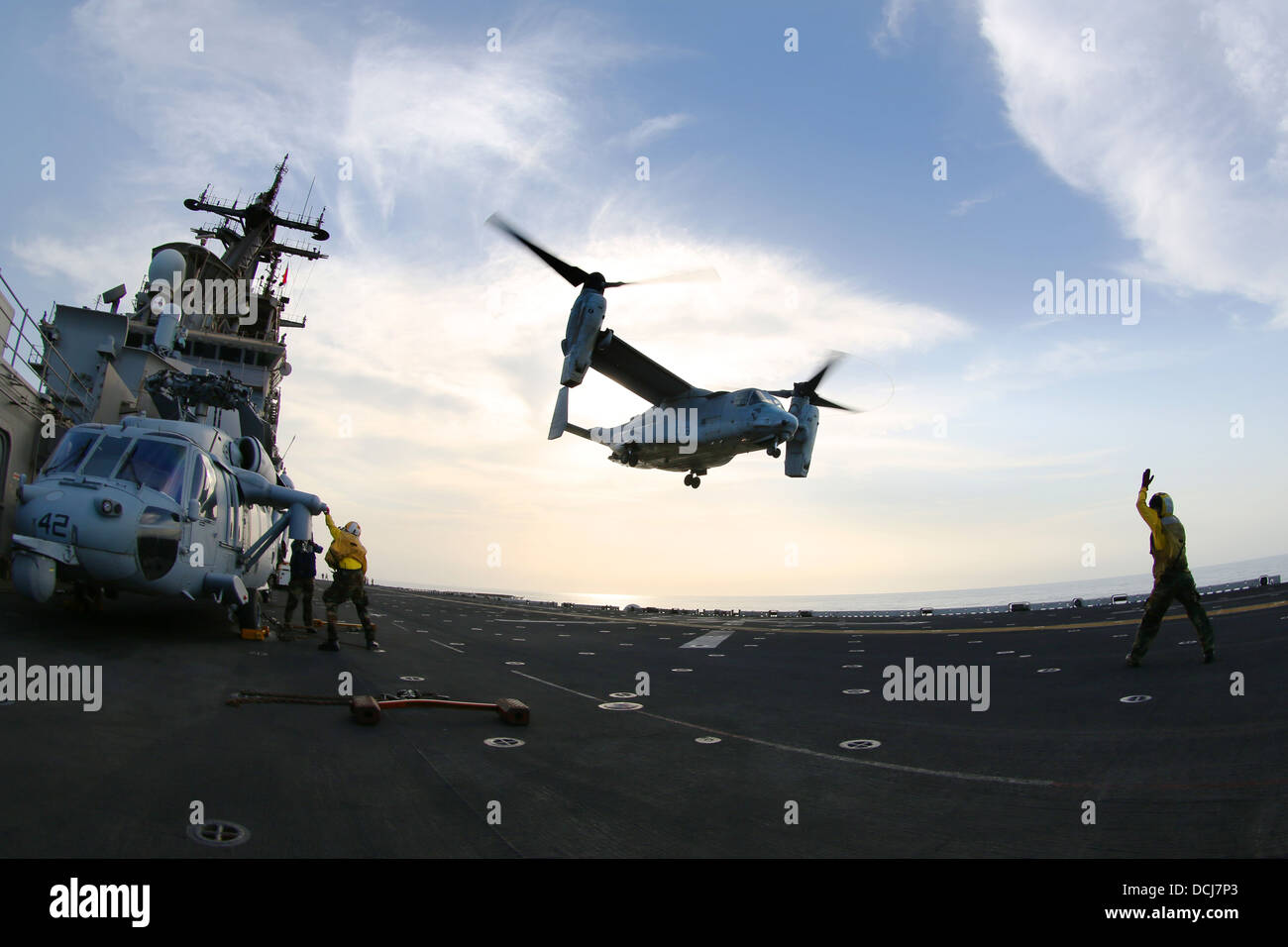 An MV-22 Osprey takes off from the flight deck of the amphibious assault ship USS Kearsarge (LHD 3). Kearsarge is the flagship for the Kearsarge Amphibious Ready Group and, with the embarked 26th Marine Expeditionary Unit, is deployed in support of mariti Stock Photo