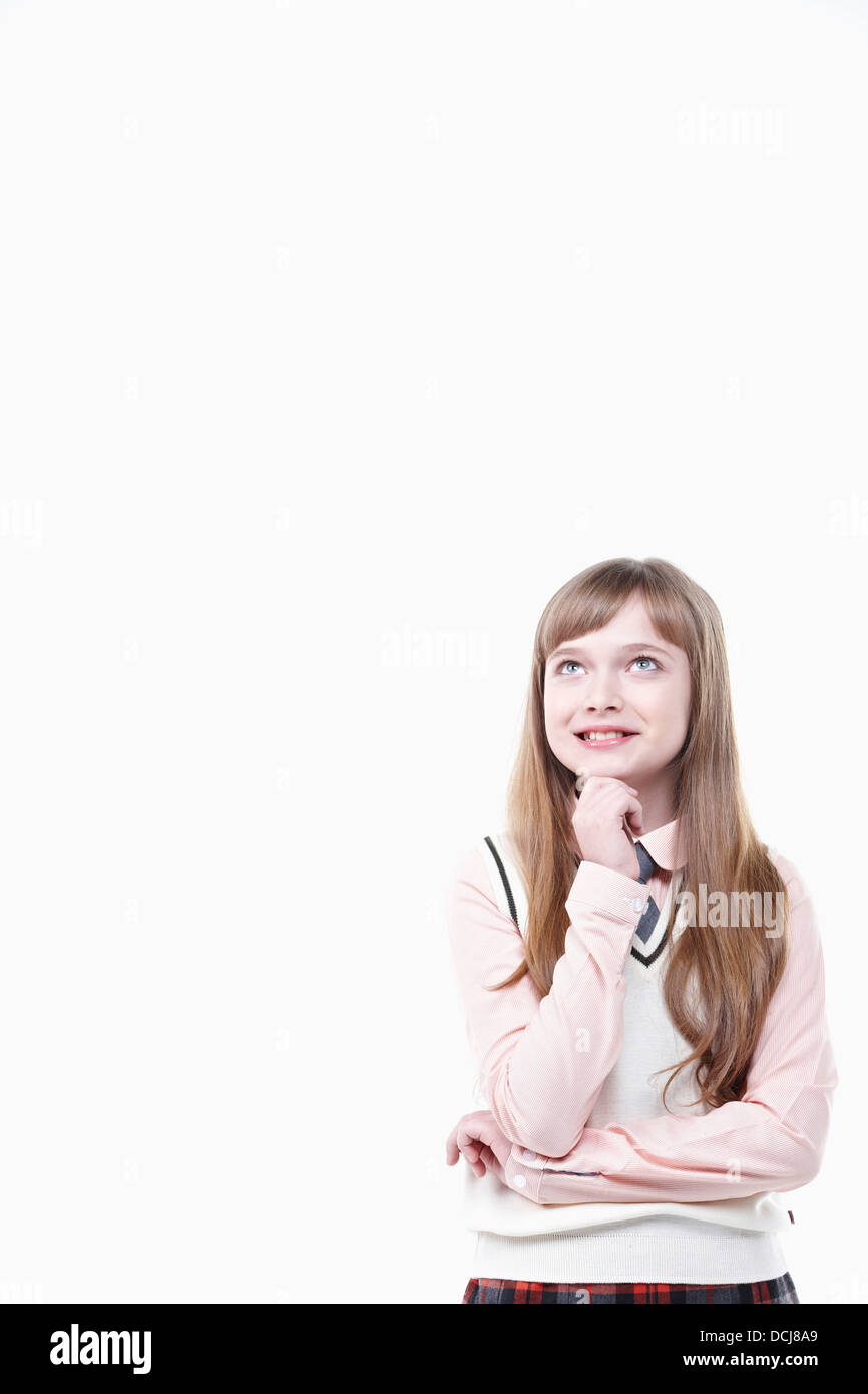 a student in uniform thinking on white background Stock Photo Alamy