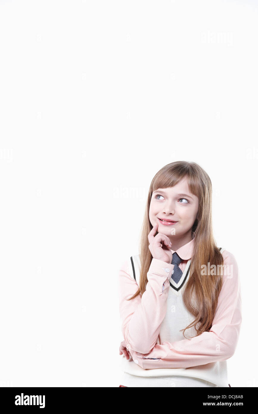 a student in uniform thinking on white background Stock Photo Alamy
