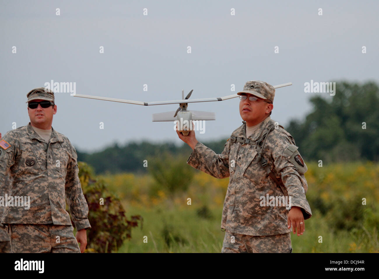 U.S. Army Staff Sgt. Boris Arias from the New Jersey Army National Guard's B Troop, 102nd Cavalry Regiment, 50th Infantry Brigade Combat Team prepares to launch his RQ-11B Raven unmanned aerial vehicle while Staff Sgt. James Nirenberg, a Raven master inst Stock Photo