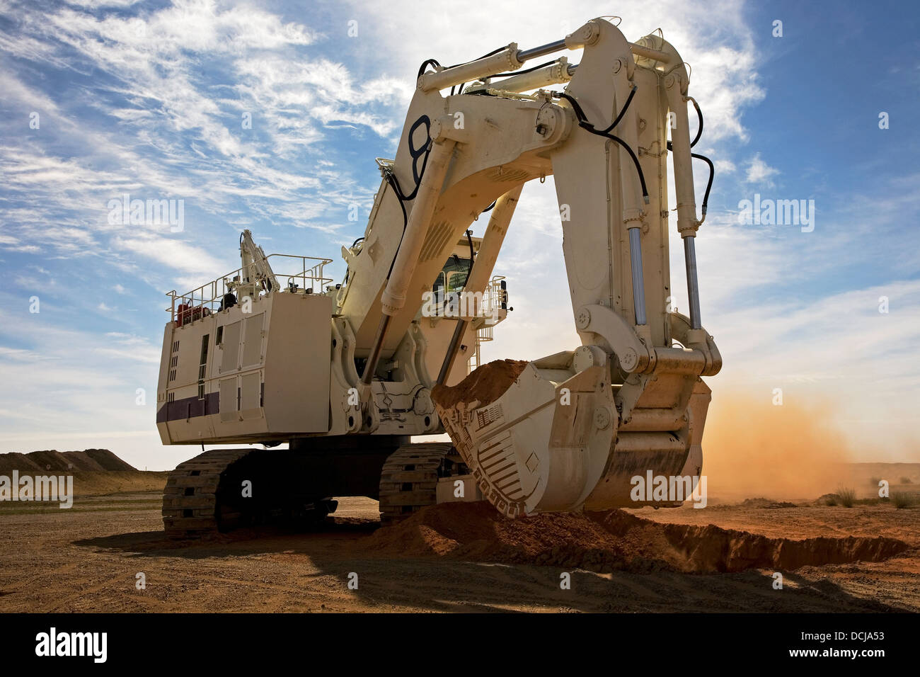 Bucyrus Caterpillar hydraulic excavator digger breaking new ground on a surface gold mining site in Mauritania, NW Africa Stock Photo