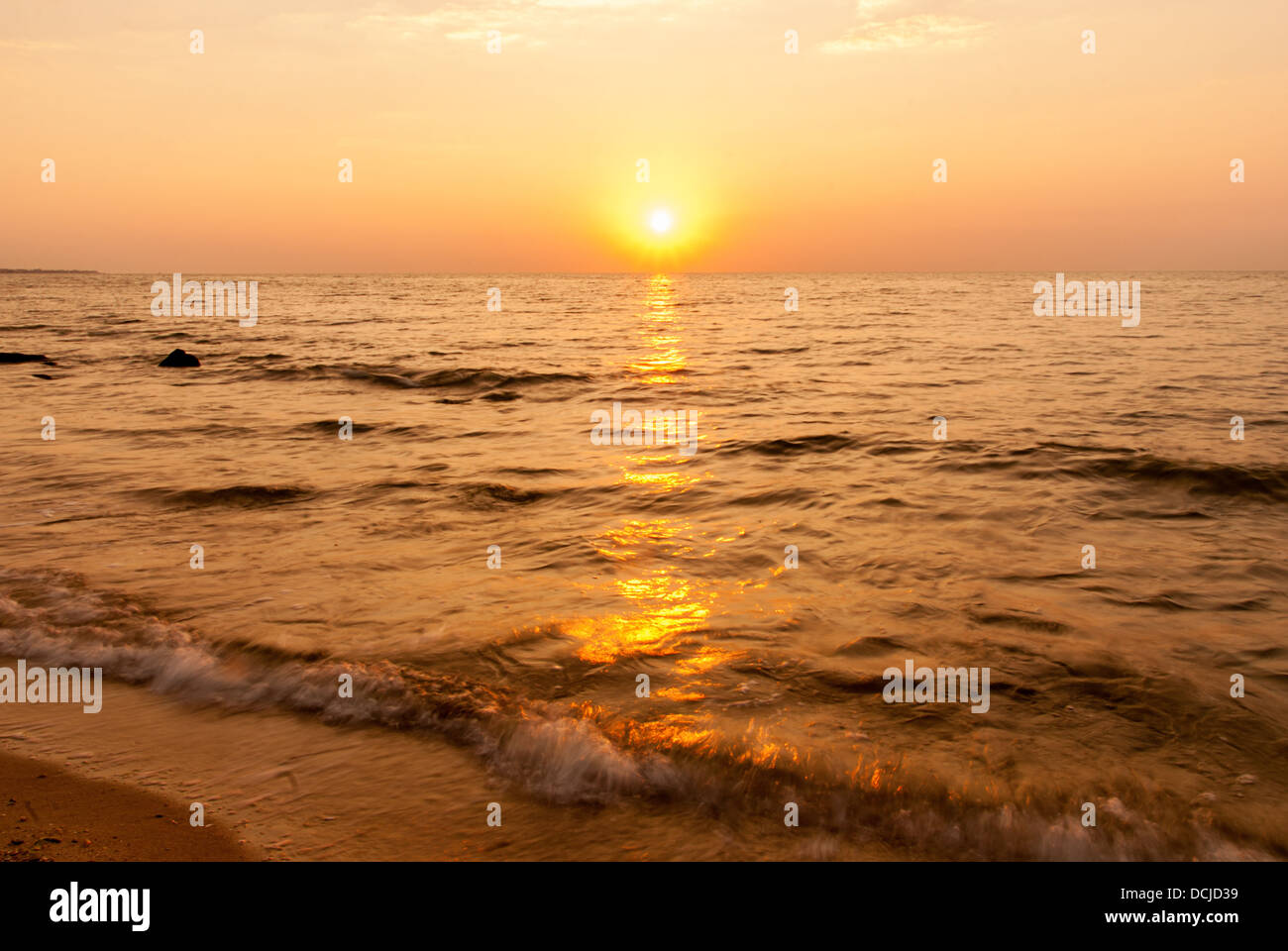 Red yellow sunrise over the sea Stock Photo - Alamy