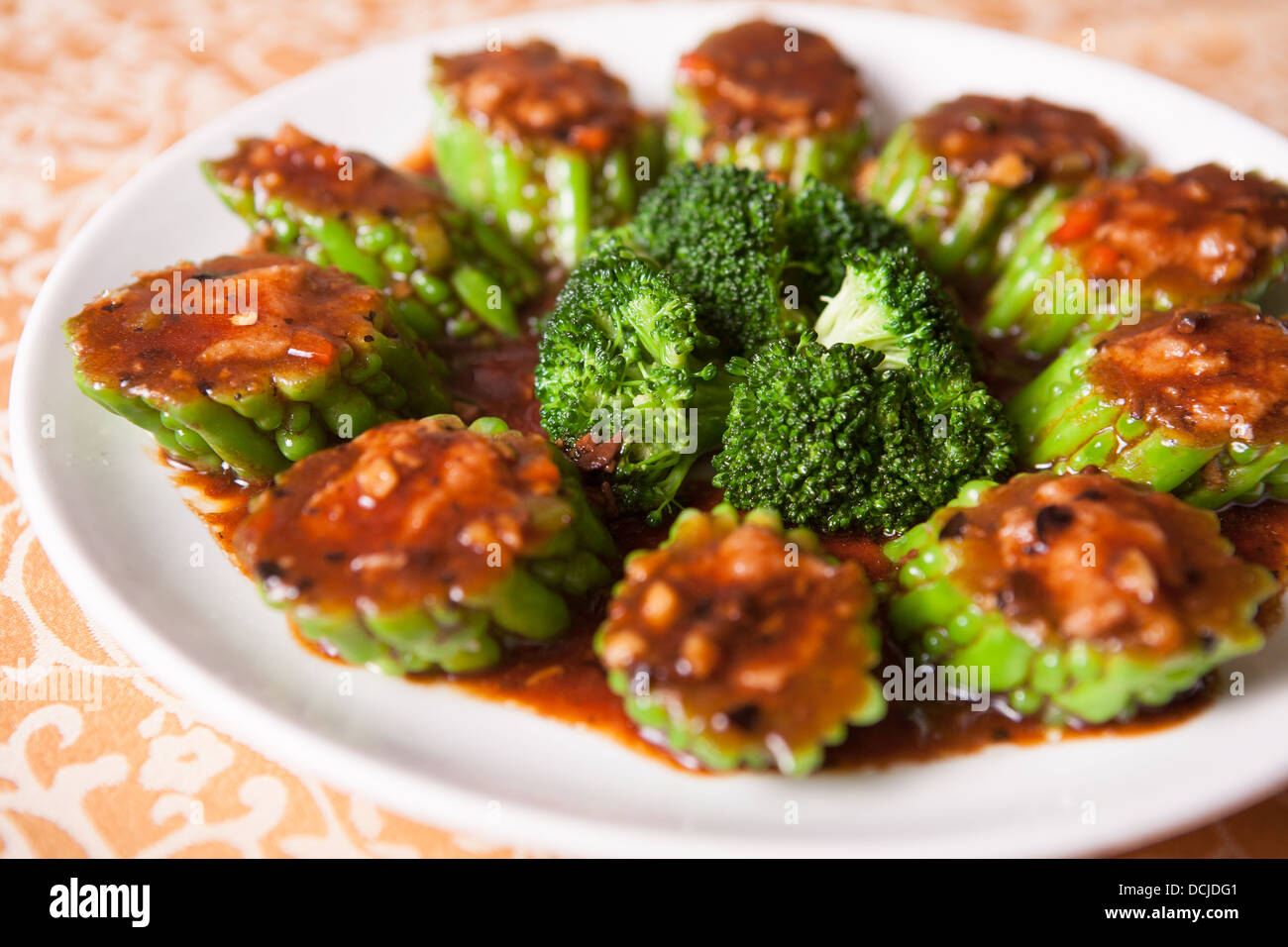 broccoli fried bitter gourd and pour gravy on top Stock Photo Alamy