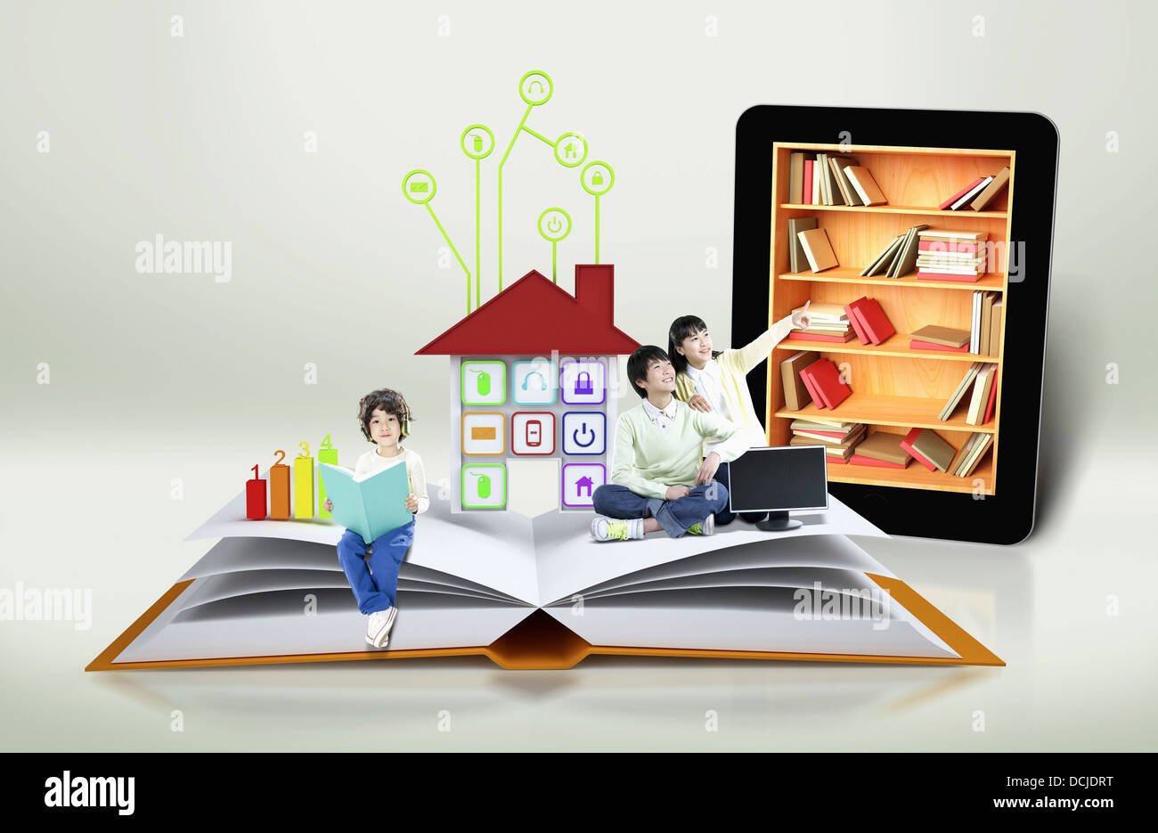 Next In Reading children reading books next to a tablet Stock Photo - Alamy