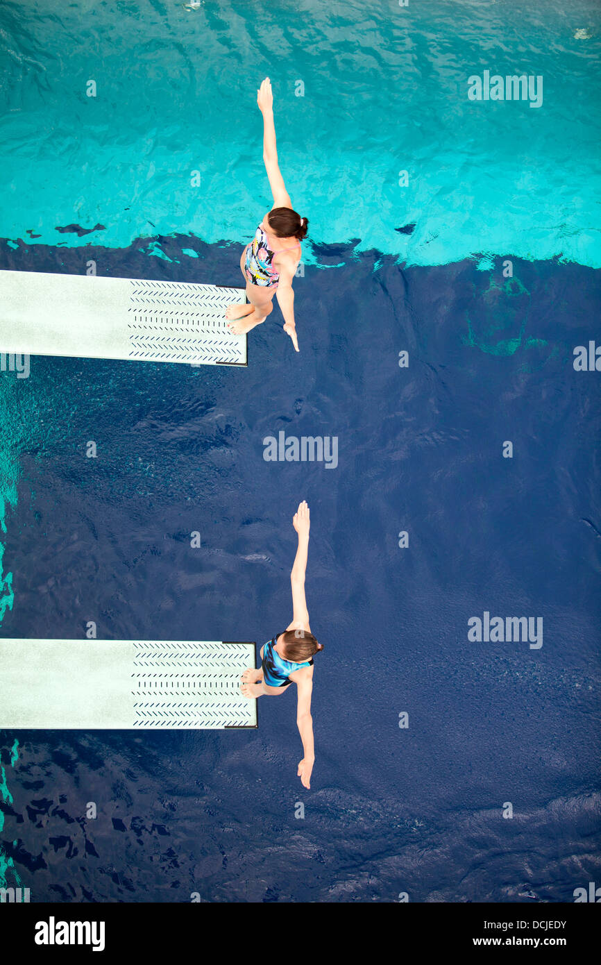 high divers jumping into the water Stock Photo Alamy