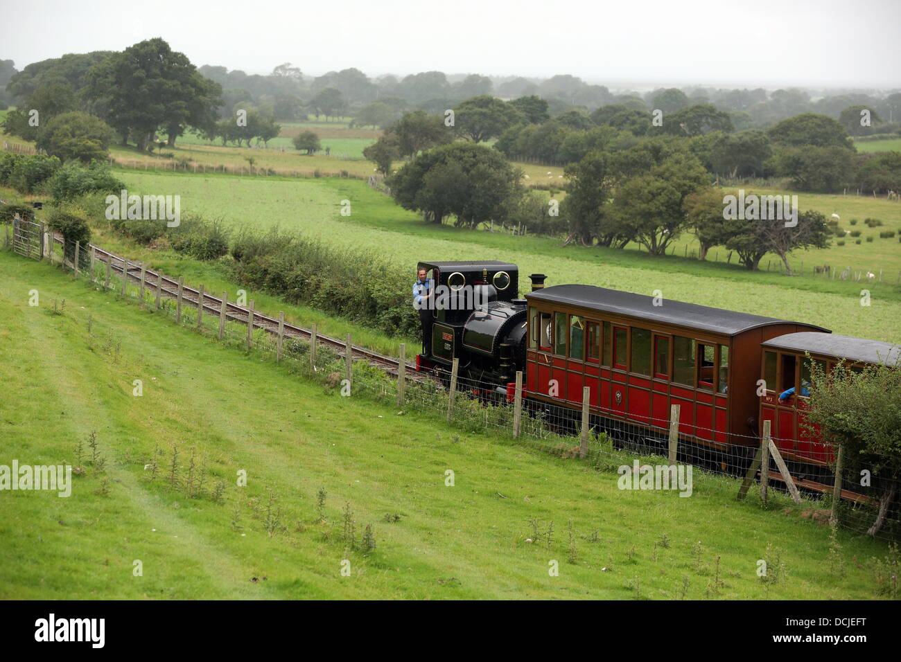 Tywyn, Wales, UK, Saturday, 17 August 2013  Pictured: The train.  Re: Race the Train is an annual cross country running event that takes place in Tywyn, Mid Wales. The race is organised by Tywyn Rotary Club, and attracts runners from all over the world. In the main event, runners compete to beat a steam train on the preserved Talyllyn Railway over a distance of 14 miles (23 km).  The event was the idea of local dentist, Godfrey Worsey, and was first run in 1984 with around 48 runners. © D Legakis/Alamy Live News Stock Photo