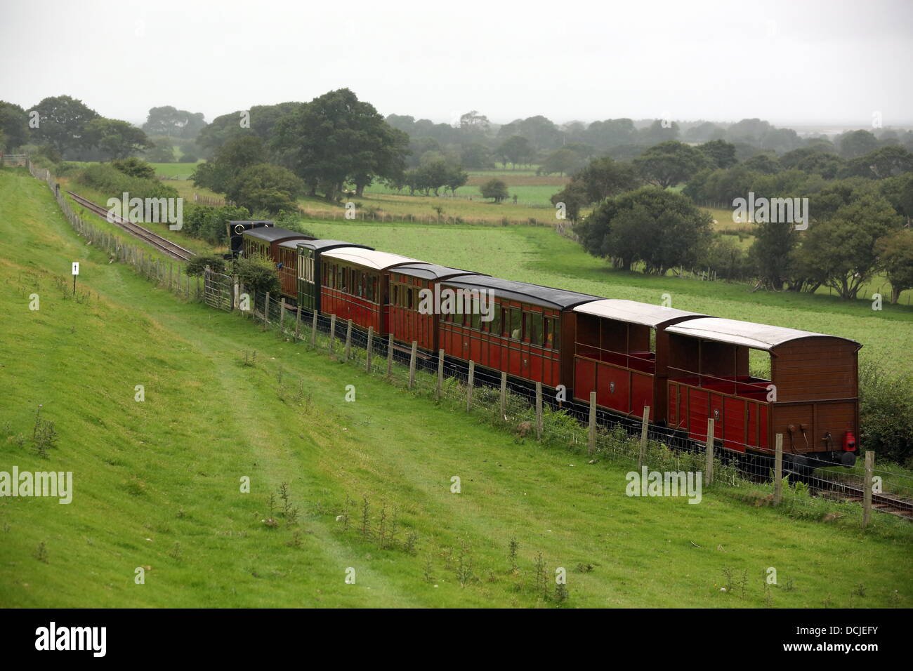 Tywyn, Wales, UK, Saturday, 17 August 2013  Pictured: The train.  Re: Race the Train is an annual cross country running event that takes place in Tywyn, Mid Wales. The race is organised by Tywyn Rotary Club, and attracts runners from all over the world. In the main event, runners compete to beat a steam train on the preserved Talyllyn Railway over a distance of 14 miles (23 km).  The event was the idea of local dentist, Godfrey Worsey, and was first run in 1984 with around 48 runners. © D Legakis/Alamy Live News Stock Photo