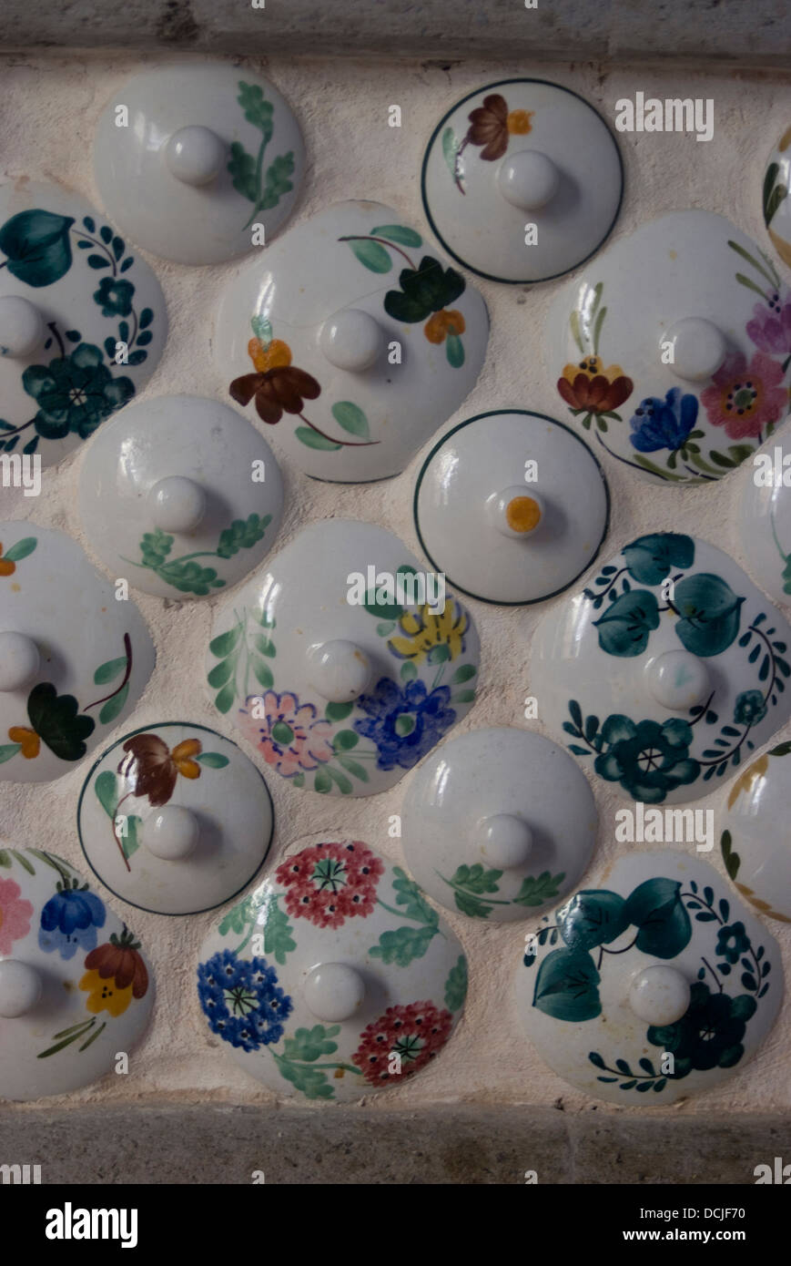 Unusual Italian kitchen wall, design consisting of teapot lids in an apartment in Sorrento, Campania, Italy Stock Photo