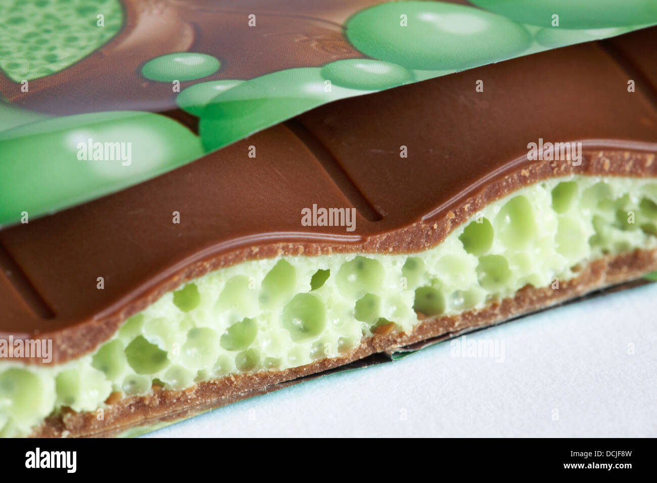 Nestle Mint aero new bubbly big bar of chocolate  with piece broken off to see inside set on white background Stock Photo
