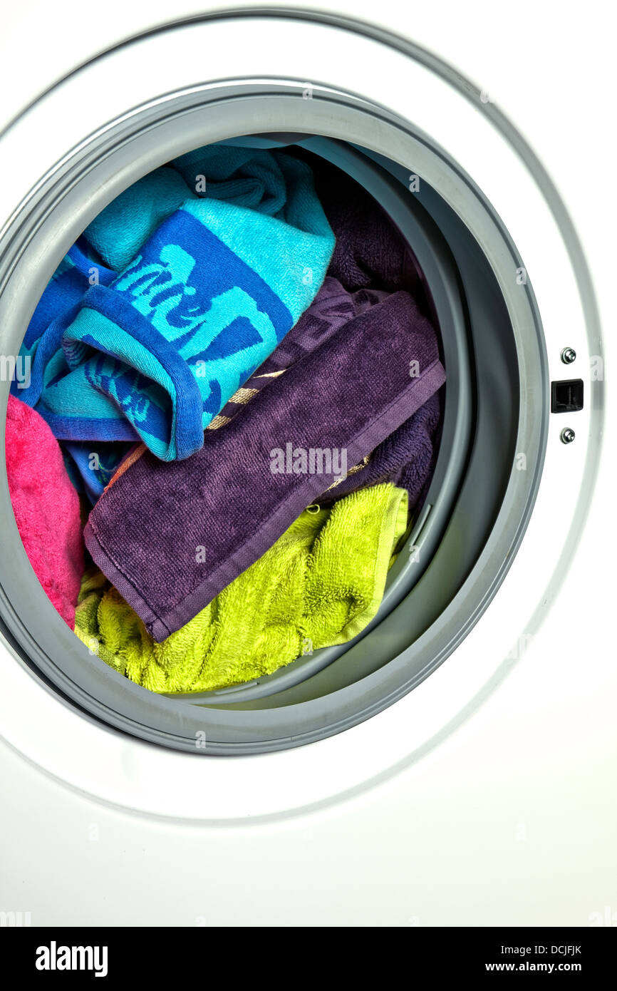 Colored towels in washing machine Stock Photo Alamy