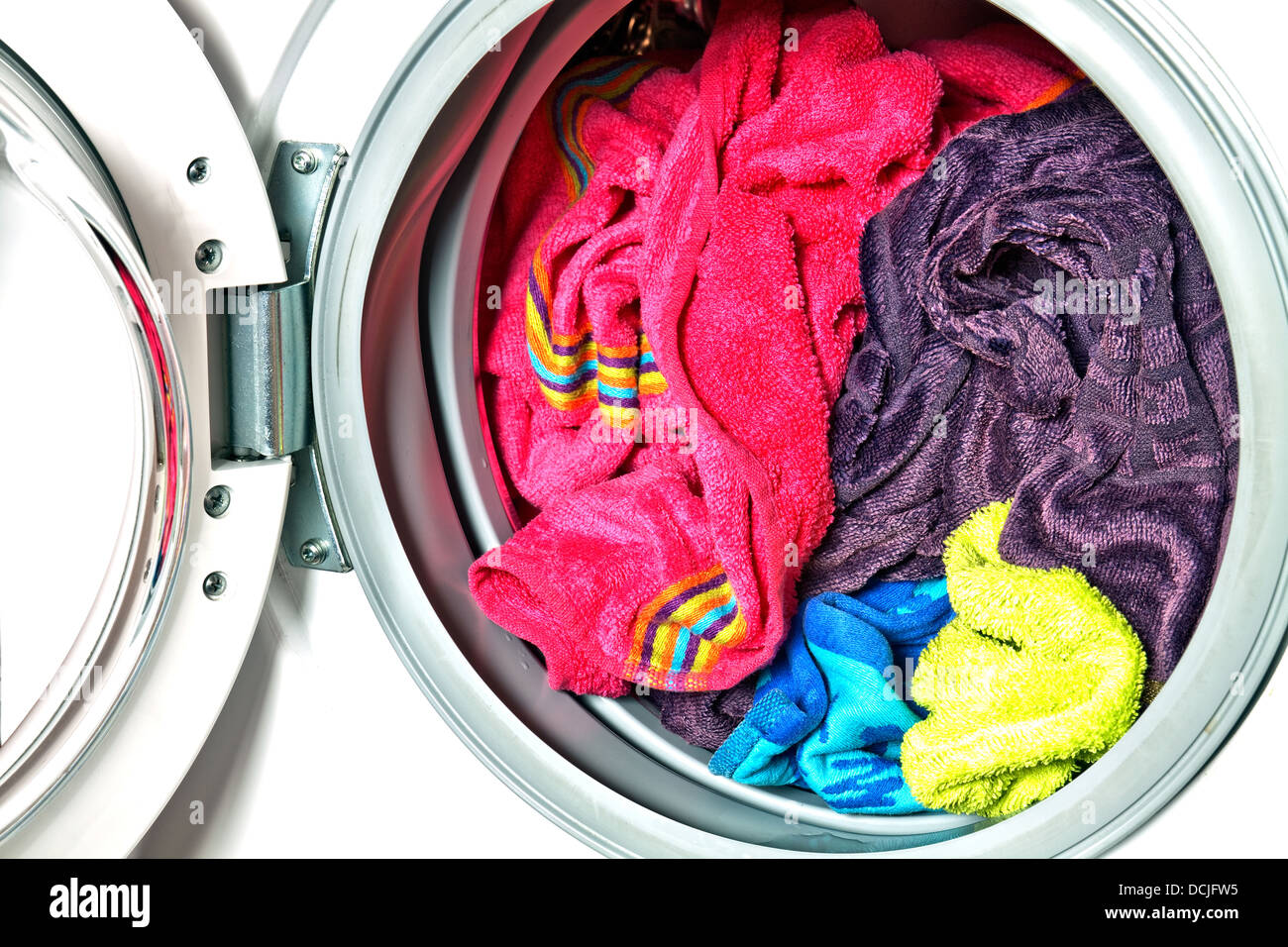 Colored towels in washing machine Stock Photo Alamy