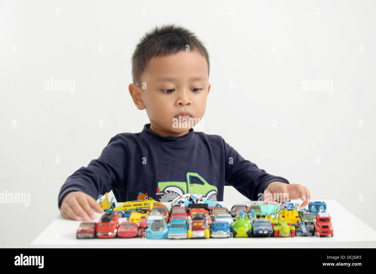 Kid playing car toys Stock Photo Alamy