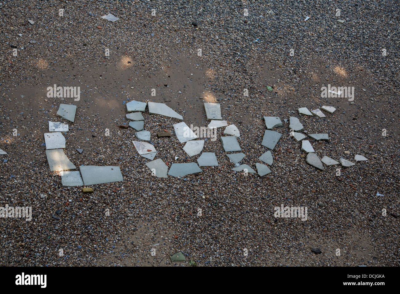 The word Love in stones on the Thames foreshore in London. Stock Photo