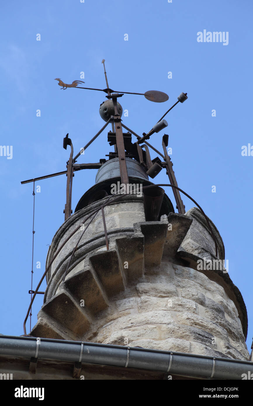 Bell tower with weather vane at the medieval city gate of Sommieres, Gard, France Stock Photo