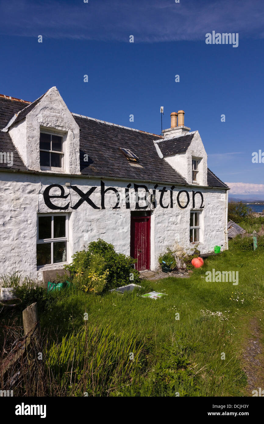 Old white painted 'exhibition' croft cottage against blue sky, Broadford, Isle of Skye, Scotland, UK Stock Photo
